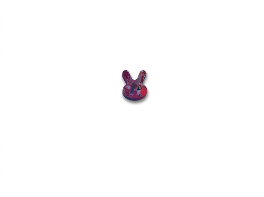 Handmade bunny-shaped Waxadoodle crayon in deep raspberry and cherry red