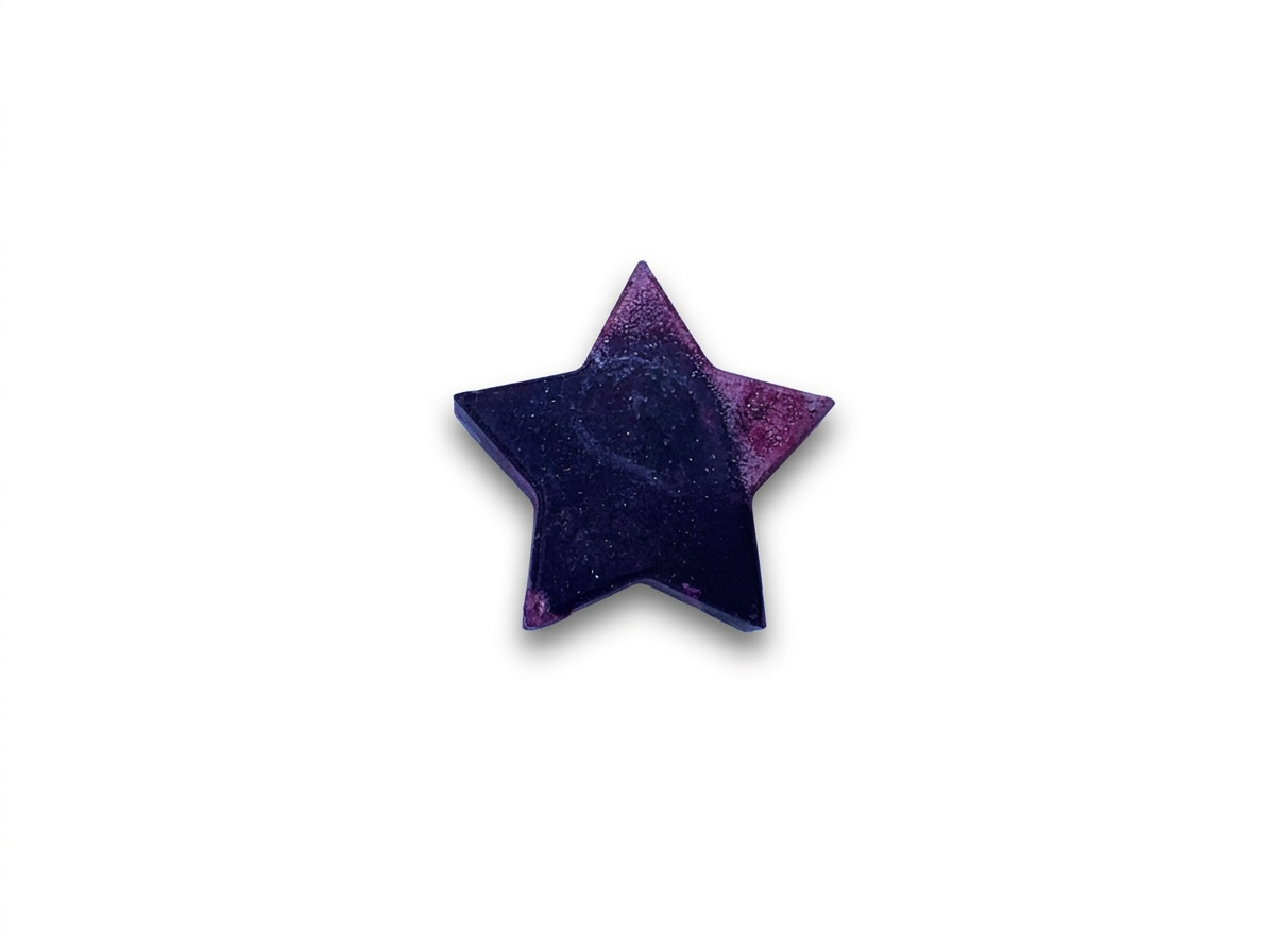 Handmade star-shaped Waxadoodle crayon with swirled colors