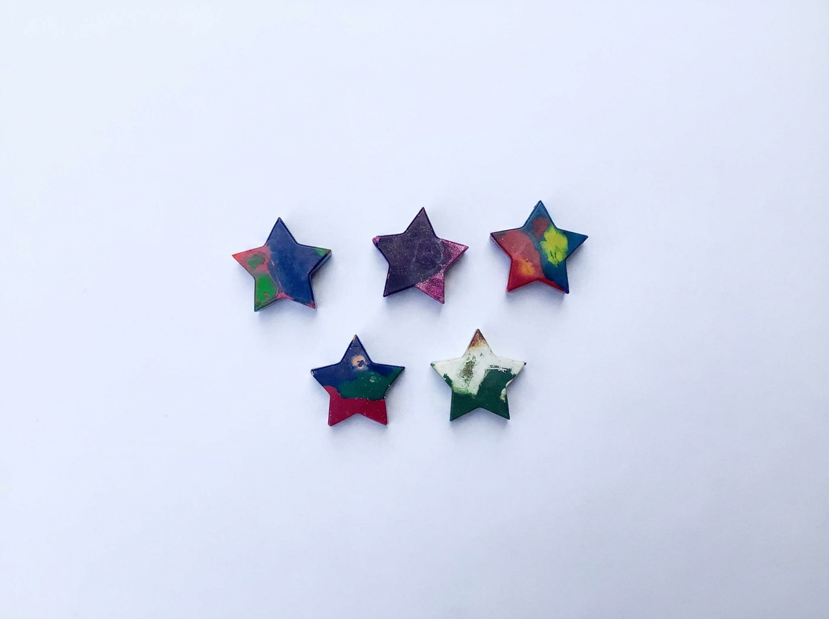 Handmade star-shaped Waxadoodle crayon with swirled colors