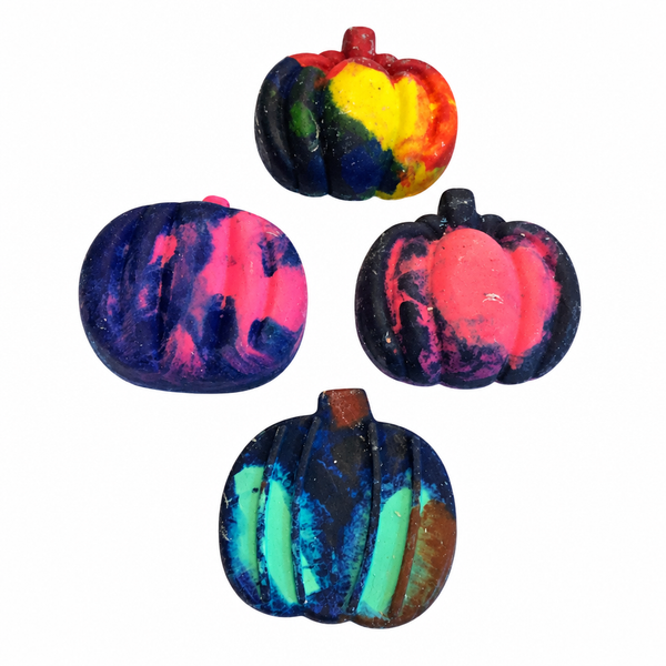 Four swirly pumpkin-shaped crayons on a pure white background
